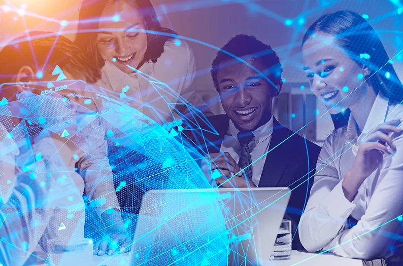 A diverse group of people looking at a laptop a globe superimposed on top in blue.